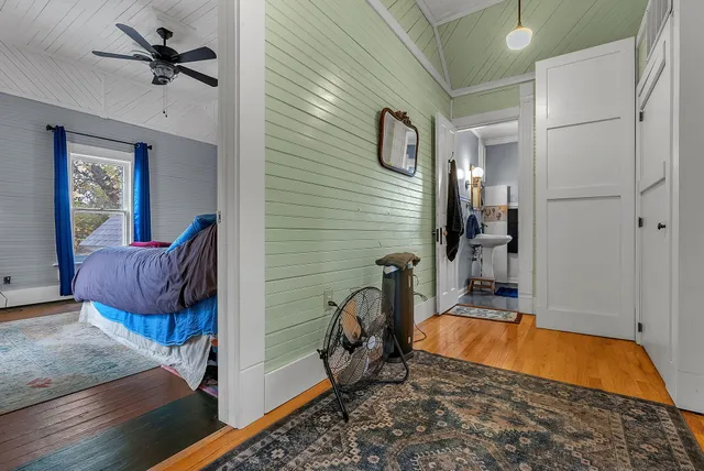 a living room with furniture and a dresser
