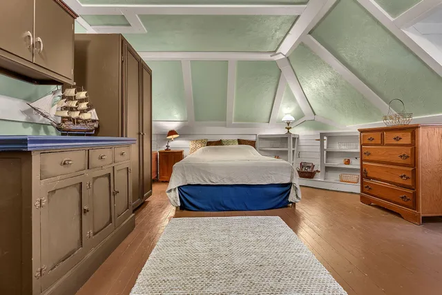 a view of deck with furniture and barbeque oven with wooden floor