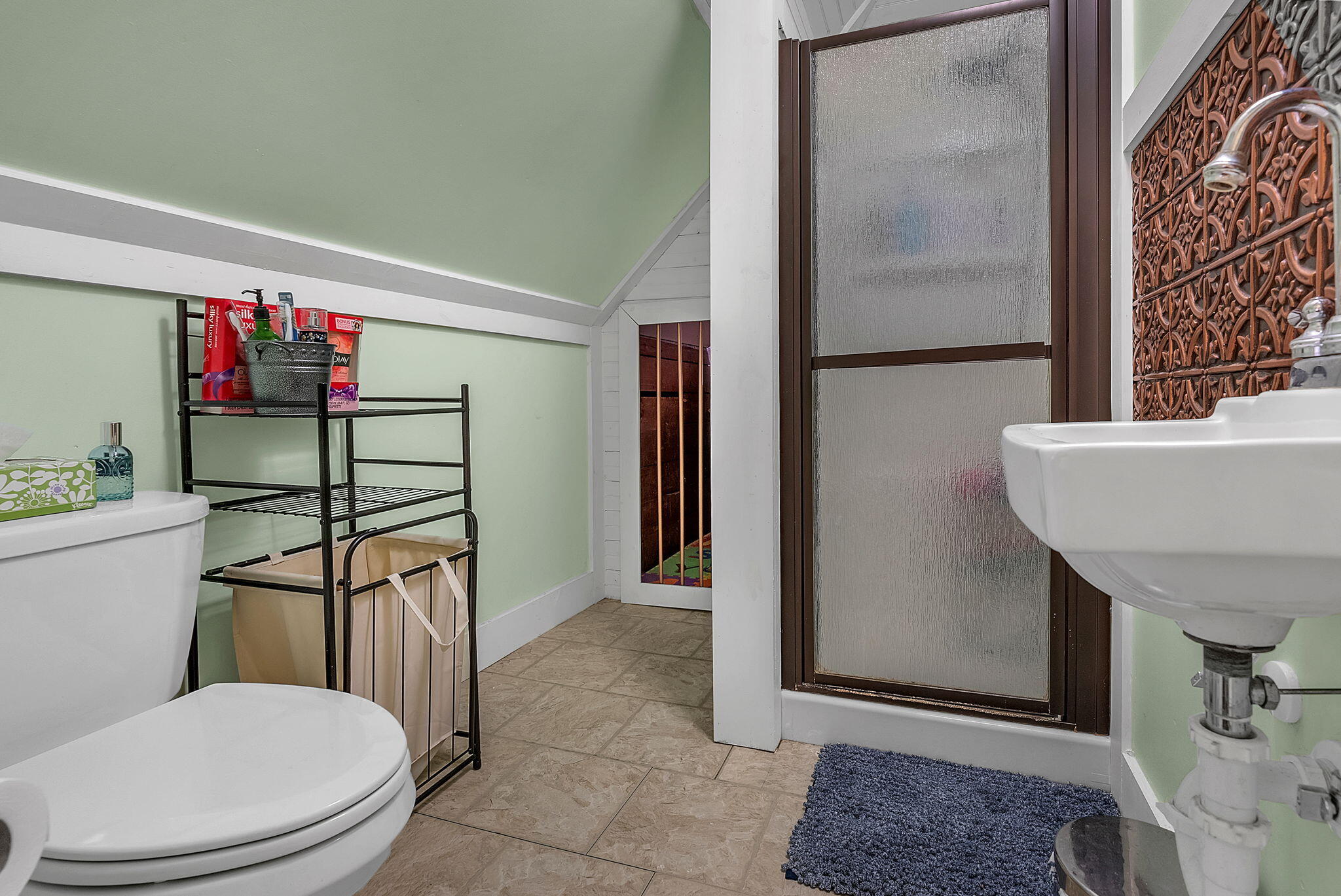 623 West Milroy Avenue Rensselaer, IN 47978 - Photo 42 of 58 a bathroom with a toilet a sink and mirror