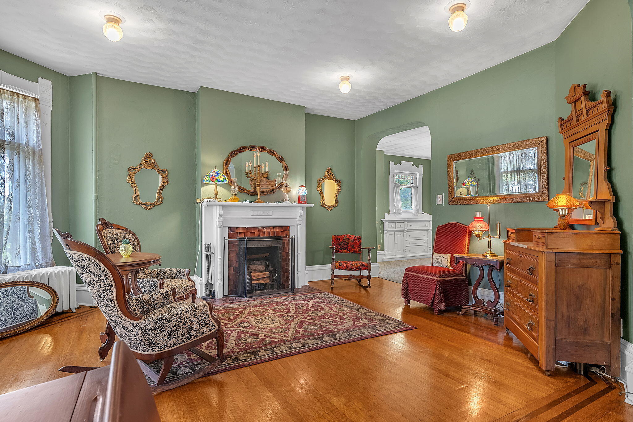 623 West Milroy Avenue Rensselaer, IN 47978 - Photo 8 of 64 a living room with furniture and a fireplace