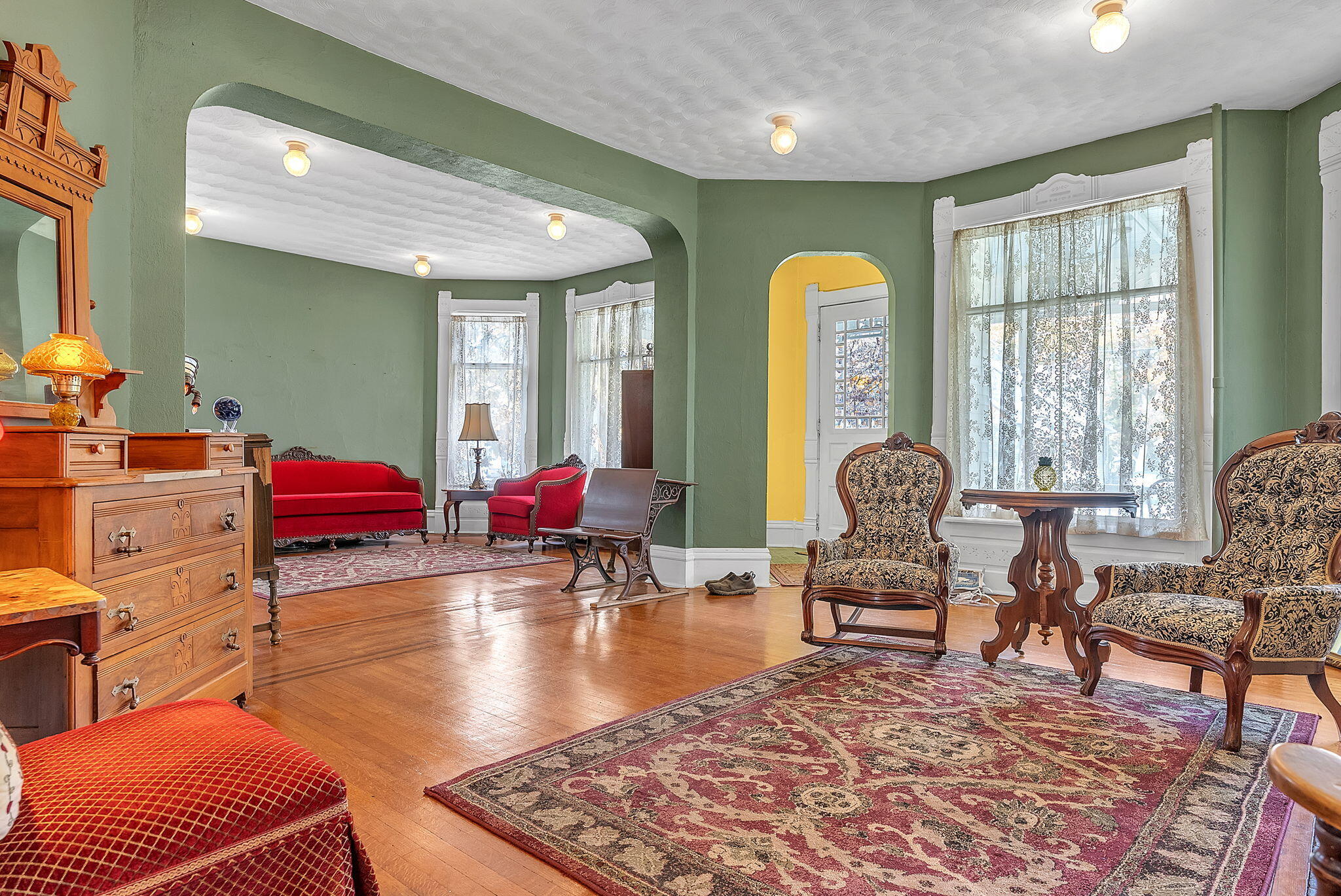 623 West Milroy Avenue Rensselaer, IN 47978 - Photo 8 of 58 a living room with furniture a rug and a chandelier