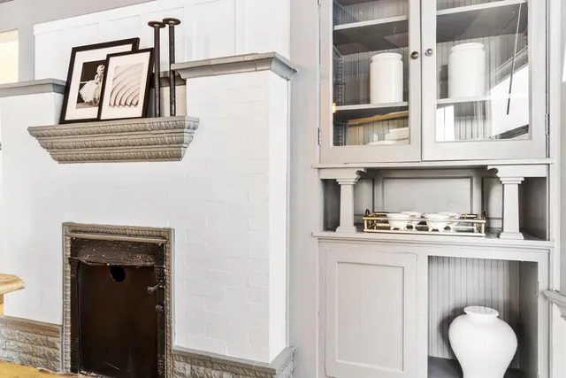 a kitchen with granite countertop a refrigerator a stove a sink and a refrigerator