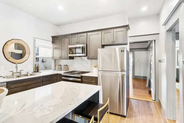 a kitchen with a stove and a sink