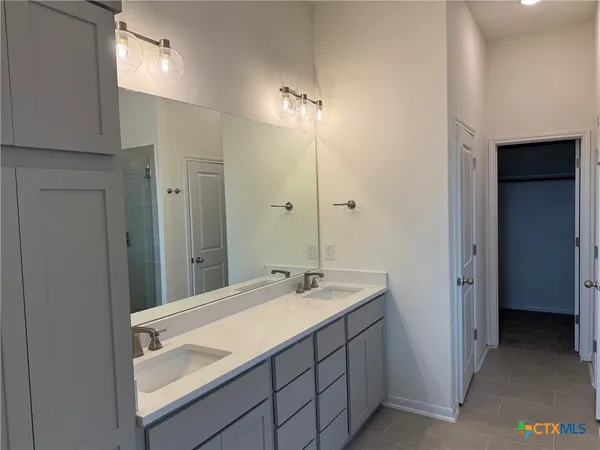 a bathroom with a sink a toilet and a bathtub
