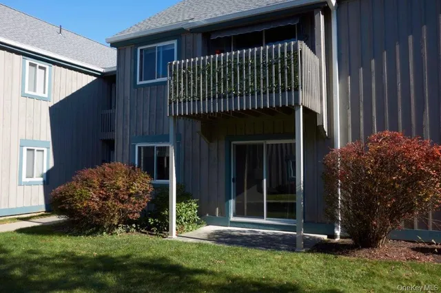 a view of a house with a tree