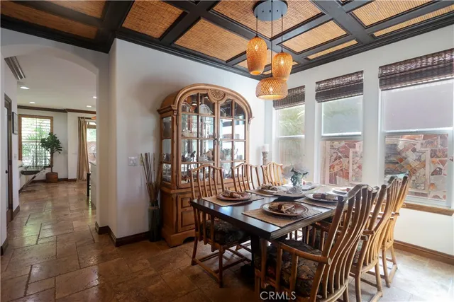 a view of a dining room and livingroom with furniture