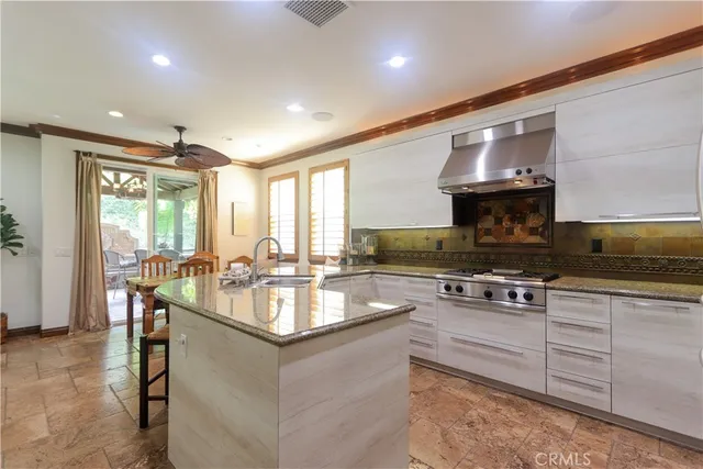 a kitchen with counter top space appliances and cabinets