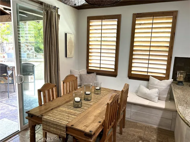 a large kitchen with a table and chairs