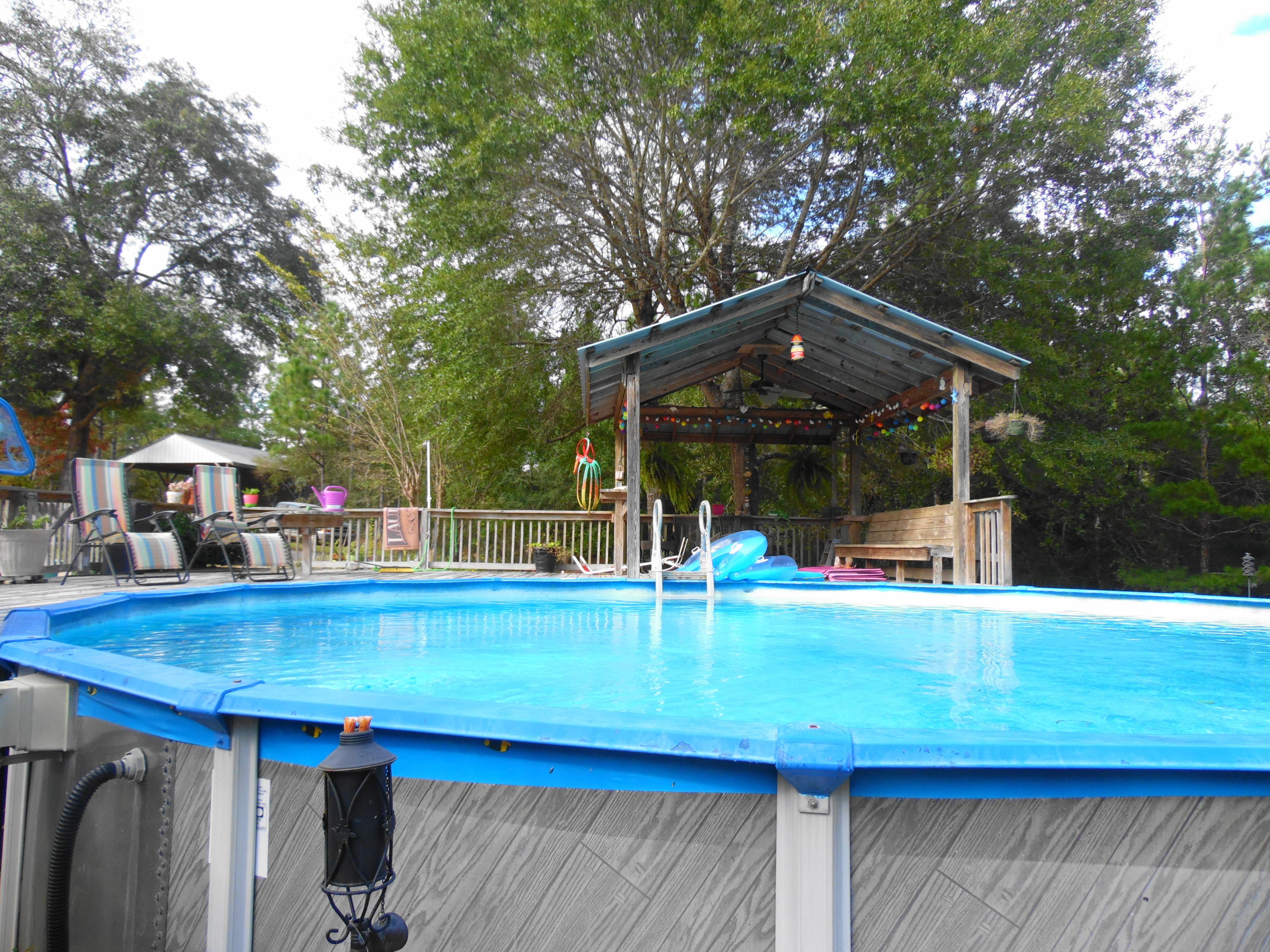 642 Elmwood Road DeFuniak Springs, FL 32433 - Photo 11 of 37 a view of pool with an outdoor seating