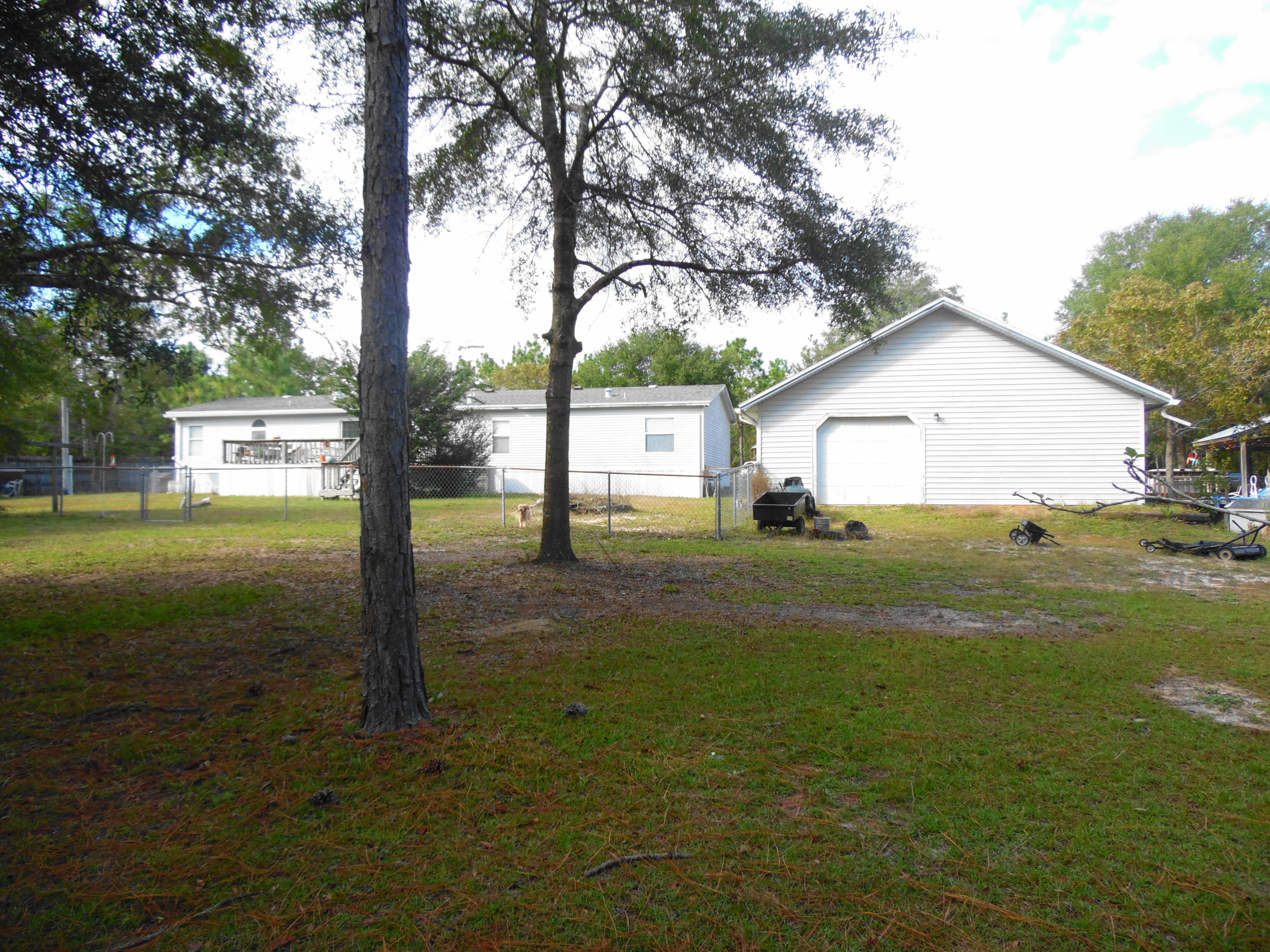 642 Elmwood Road DeFuniak Springs, FL 32433 - Photo 13 of 37 a front view of a house with garden
