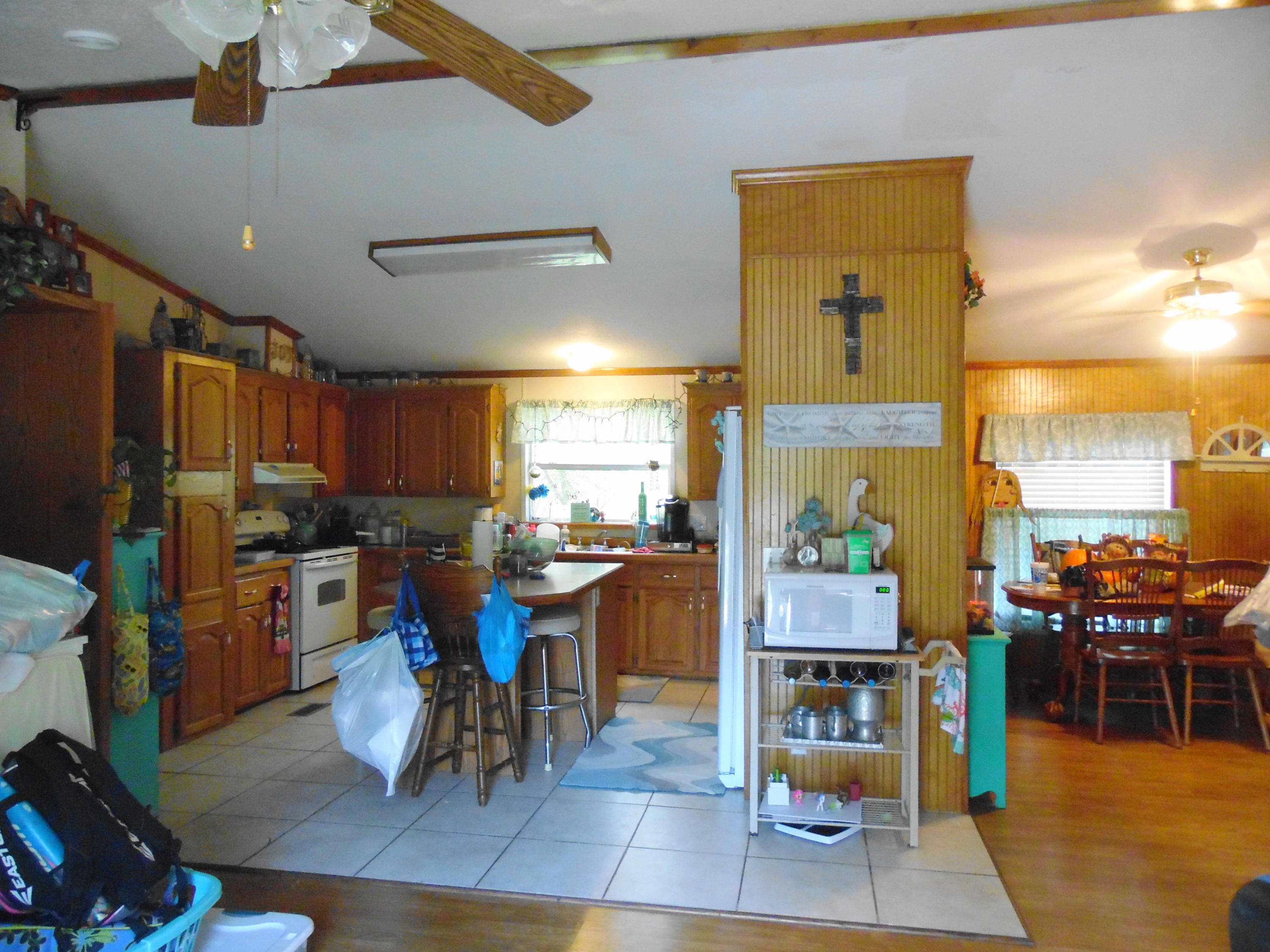 642 Elmwood Road DeFuniak Springs, FL 32433 - Photo 19 of 37 a living room with lots of furniture and kitchen view