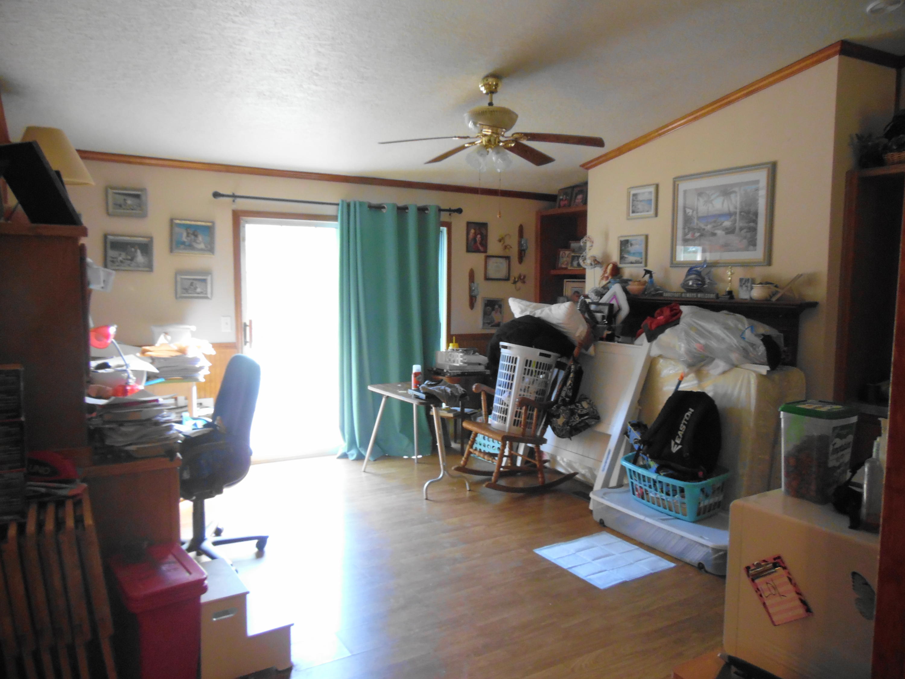 642 Elmwood Road DeFuniak Springs, FL 32433 - Photo 20 of 37 a view of a livingroom with furniture and a flat screen tv