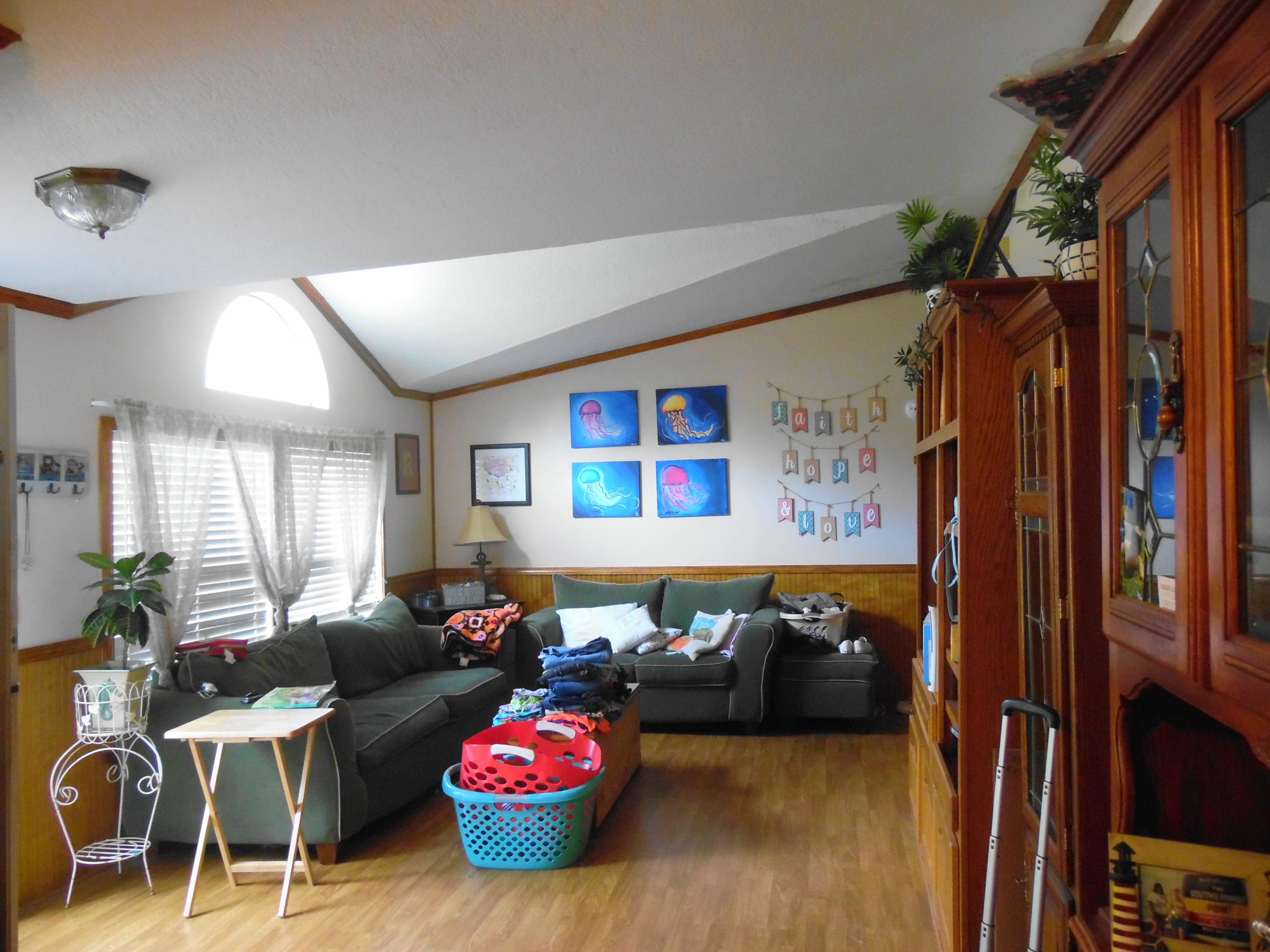 642 Elmwood Road DeFuniak Springs, FL 32433 - Photo 21 of 37 a living room with furniture a couch and a window