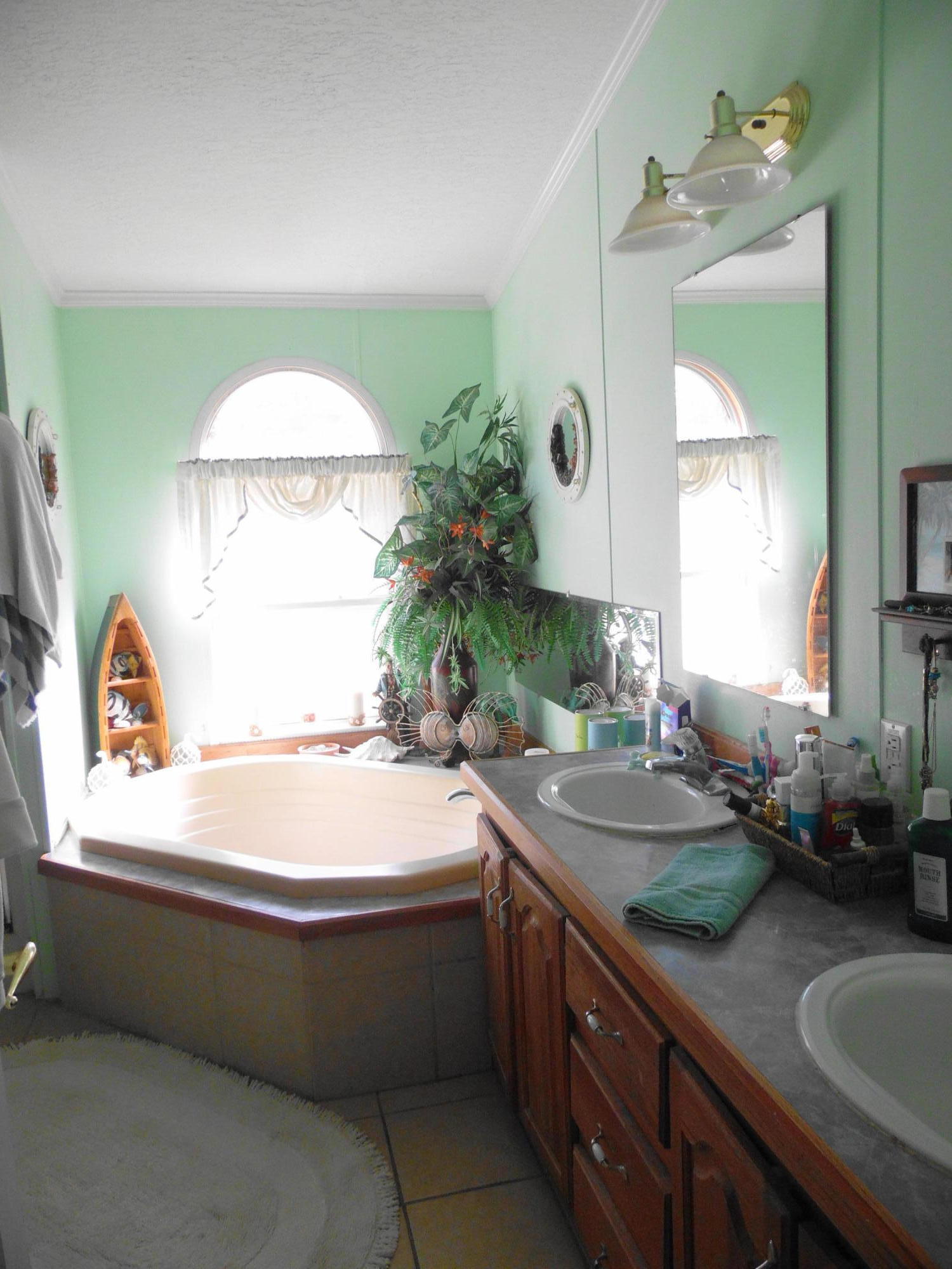 642 Elmwood Road DeFuniak Springs, FL 32433 - Photo 25 of 37 a room with a sink and a mirror