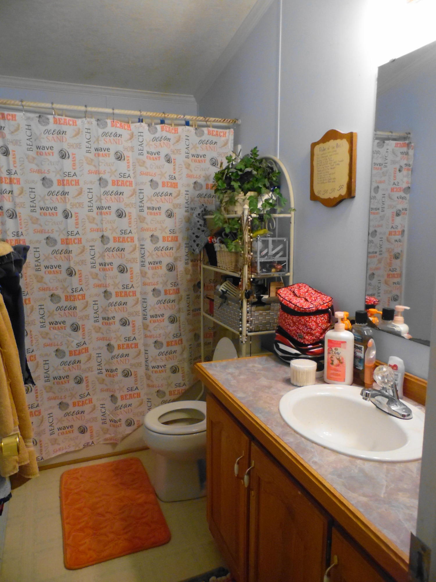 642 Elmwood Road DeFuniak Springs, FL 32433 - Photo 32 of 37 a bathroom with a sink toilet and shower