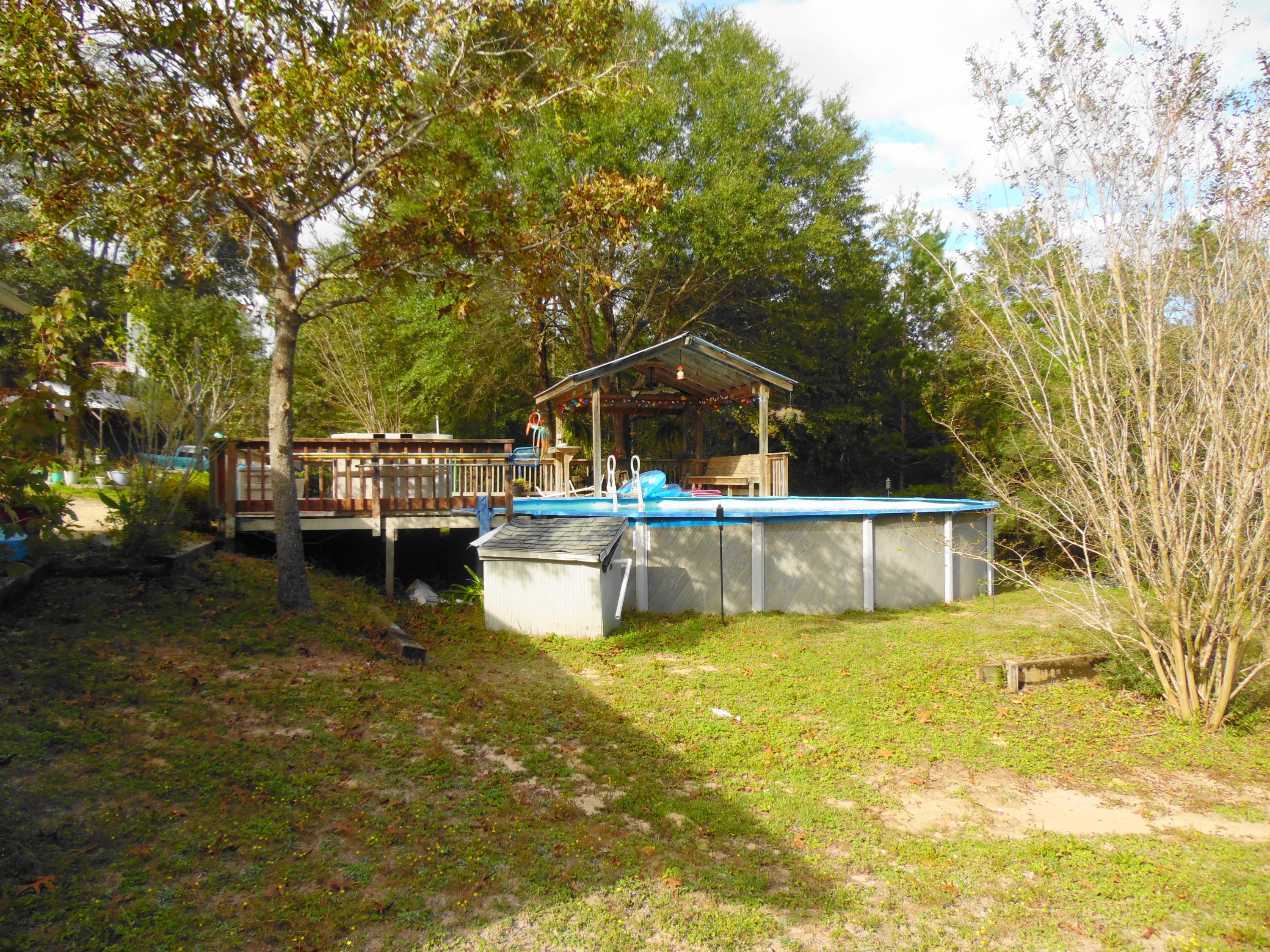 642 Elmwood Road DeFuniak Springs, FL 32433 - Photo 9 of 37 a view of a house with pool and sitting area