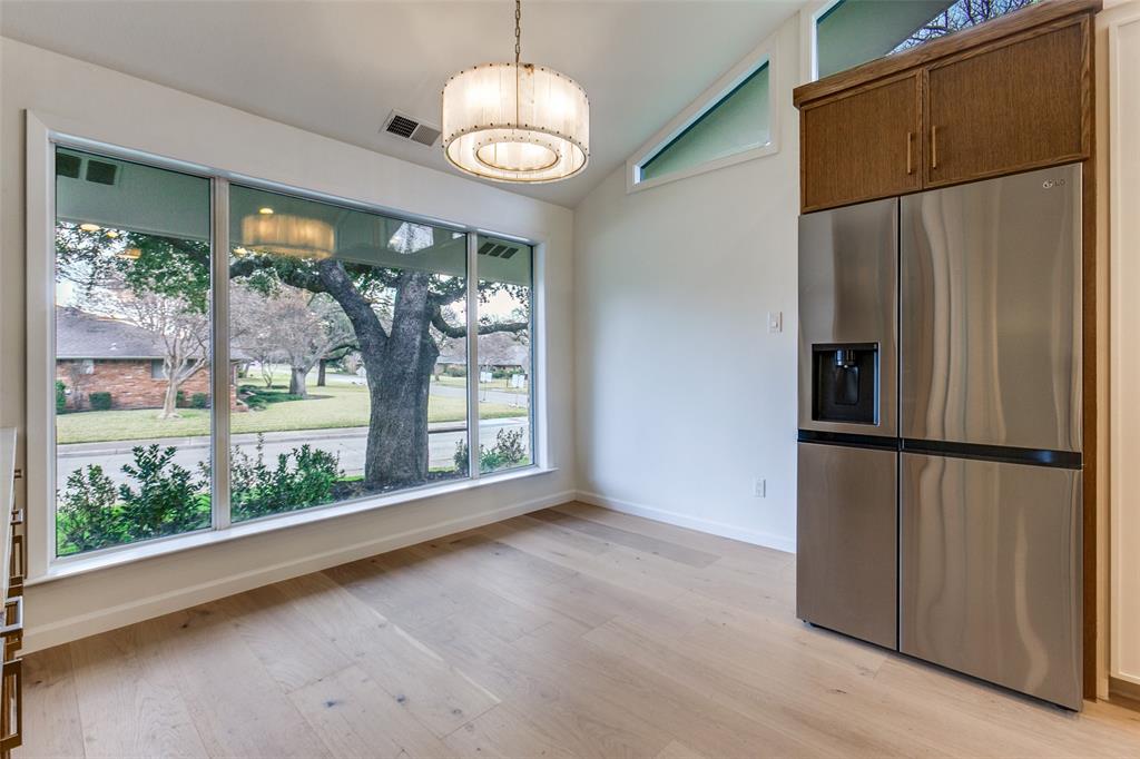 4371 Mill Creek Road Dallas, TX 75244 - Photo 11 of 33 a view of an empty room with wooden floor and a window