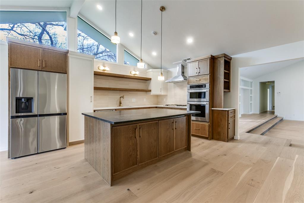 4371 Mill Creek Road Dallas, TX 75244 - Photo 12 of 33 a kitchen with stainless steel appliances granite countertop a refrigerator a sink and a stove