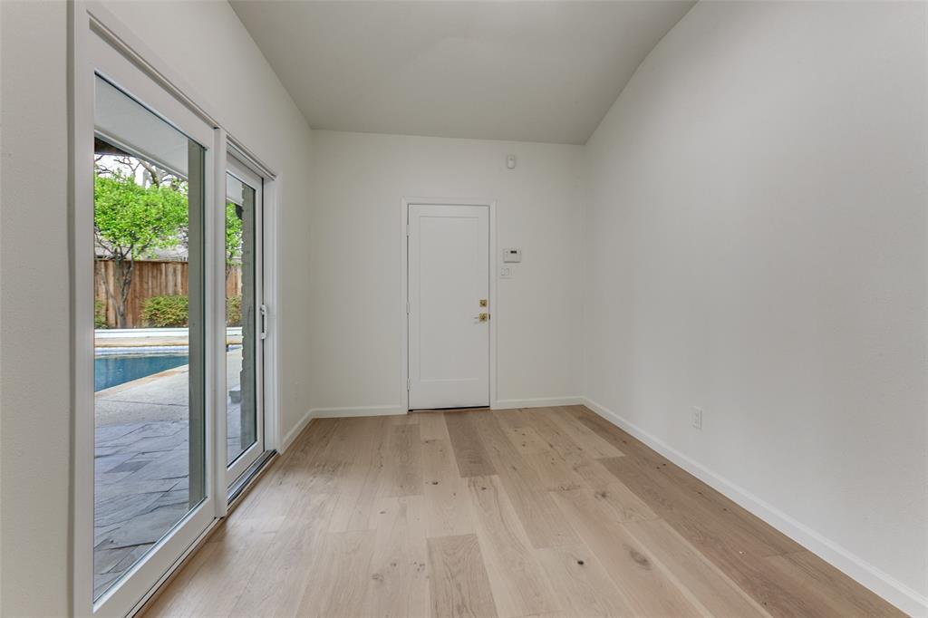 4371 Mill Creek Road Dallas, TX 75244 - Photo 16 of 33 a view of an empty room with wooden floor and a window
