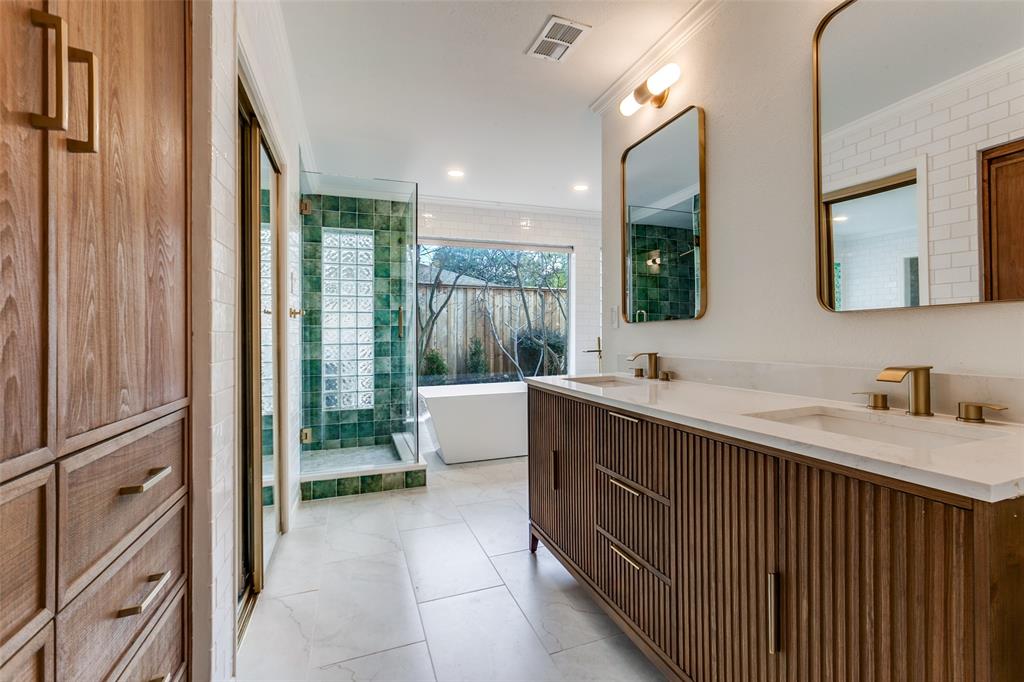 4371 Mill Creek Road Dallas, TX 75244 - Photo 23 of 33 a bathroom with a double vanity sink a mirror and a bathtub
