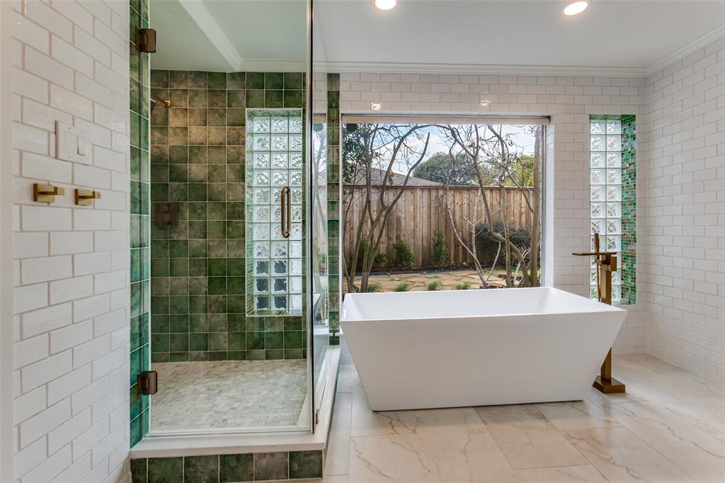 4371 Mill Creek Road Dallas, TX 75244 - Photo 24 of 33 a bathroom with a bathtub and shower