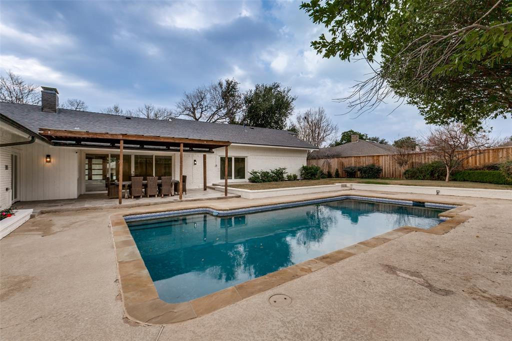 4371 Mill Creek Road Dallas, TX 75244 - Photo 25 of 33 front view of a house with swimming pool and a yard
