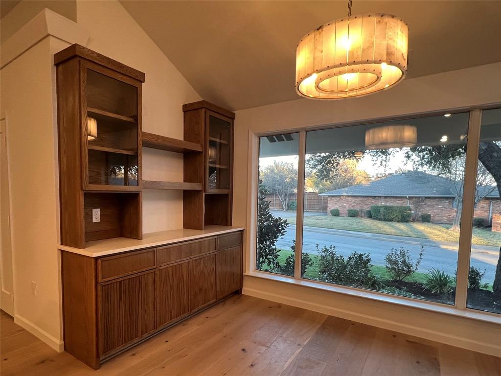 4371 Mill Creek Road Dallas, TX 75244 - Photo 28 of 33 an empty room with wooden floor and windows