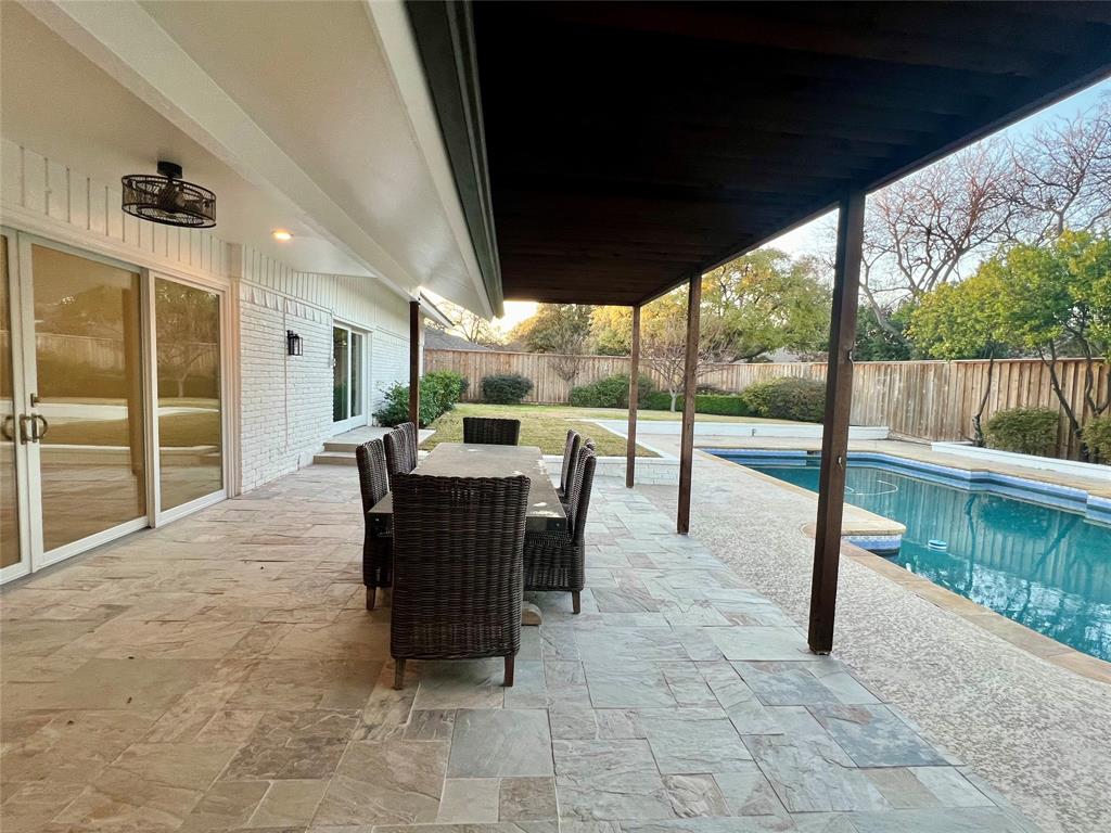 4371 Mill Creek Road Dallas, TX 75244 - Photo 29 of 33 a view of a patio with a table chairs and a patio