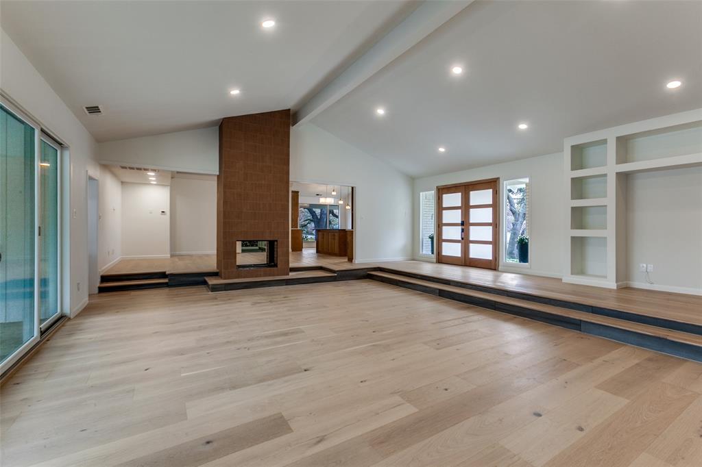 4371 Mill Creek Road Dallas, TX 75244 - Photo 5 of 33 an empty room with wooden floor and windows