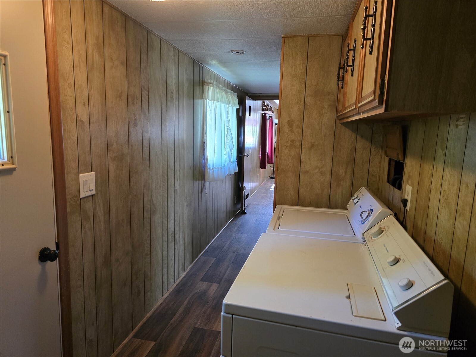 147-21 Morris Road, Unit 21 Randle, WA 98377 - Photo 28 of 31 a kitchen with a refrigerator and wooden cabinets