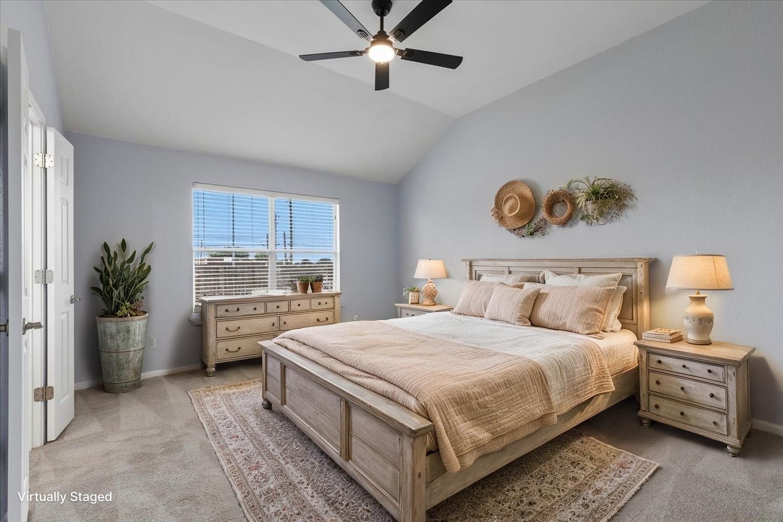 17812 Masi Loop Pflugerville, TX 78660 - Photo 18 of 38 (Virtually Staged) Spacious room featuring vaulted ceilings, a ceiling fan with integrated lighting, a large window with horizontal blinds, and neutral-toned carpeting
