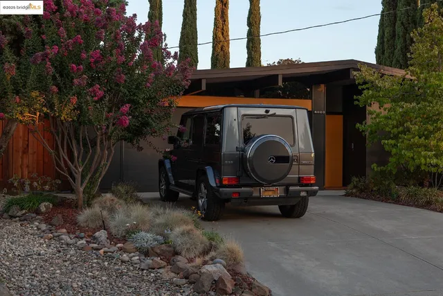 a view of car parked in front of house