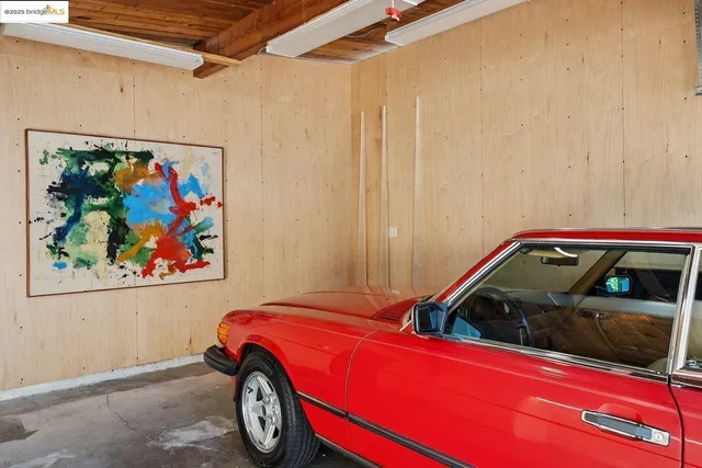 a kitchen with granite countertop a sink and cabinets