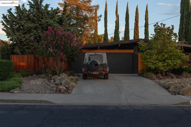 a car parked in front of a house