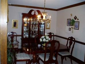 4303 Plateau Road Newton, NC 28658 - Photo 3 of 9 a view of a dining room with furniture and chandelier