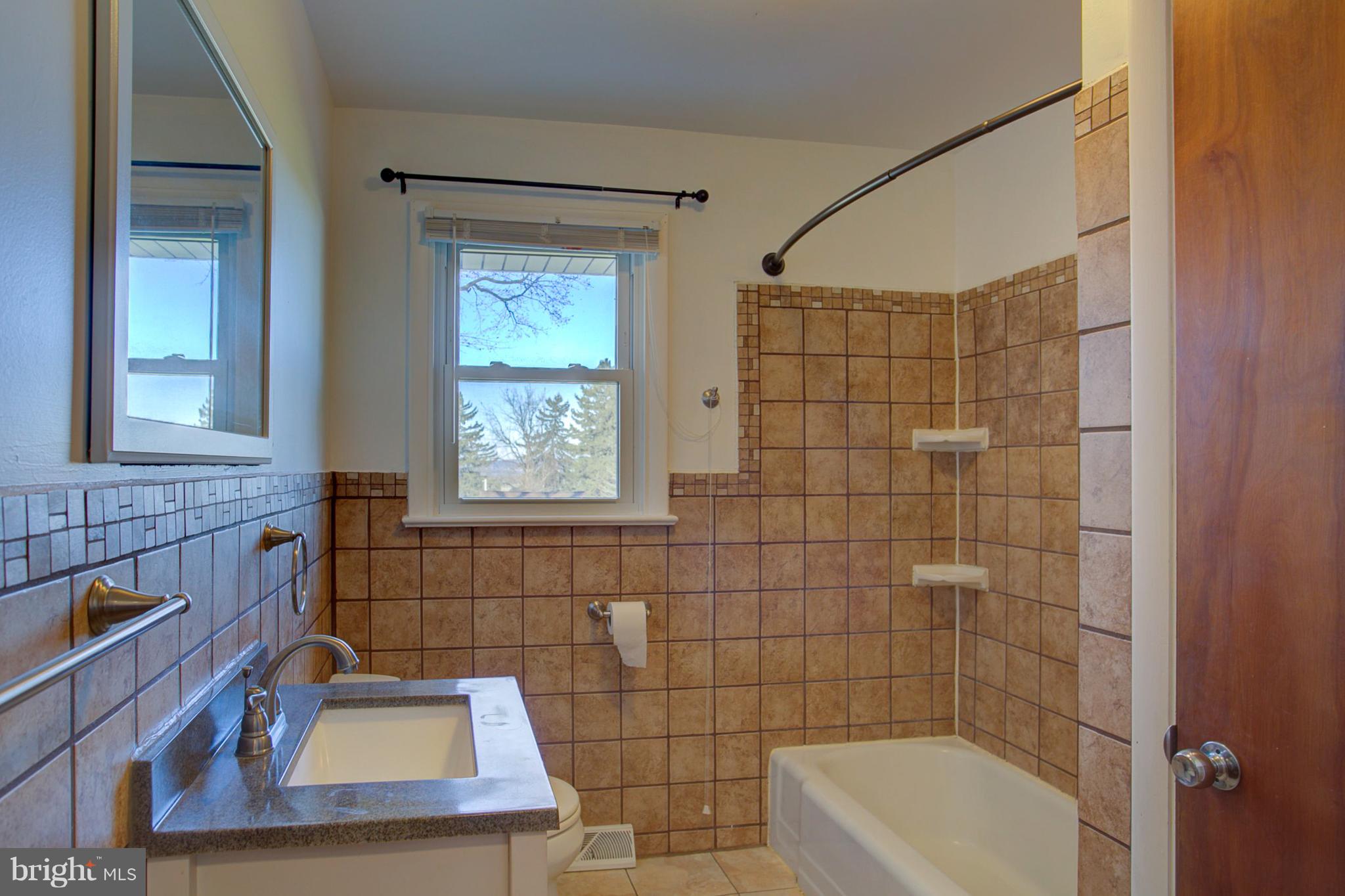 1047 Letort Road Conestoga, PA 17516 - Photo 13 of 30 a bathroom with a sink and a window