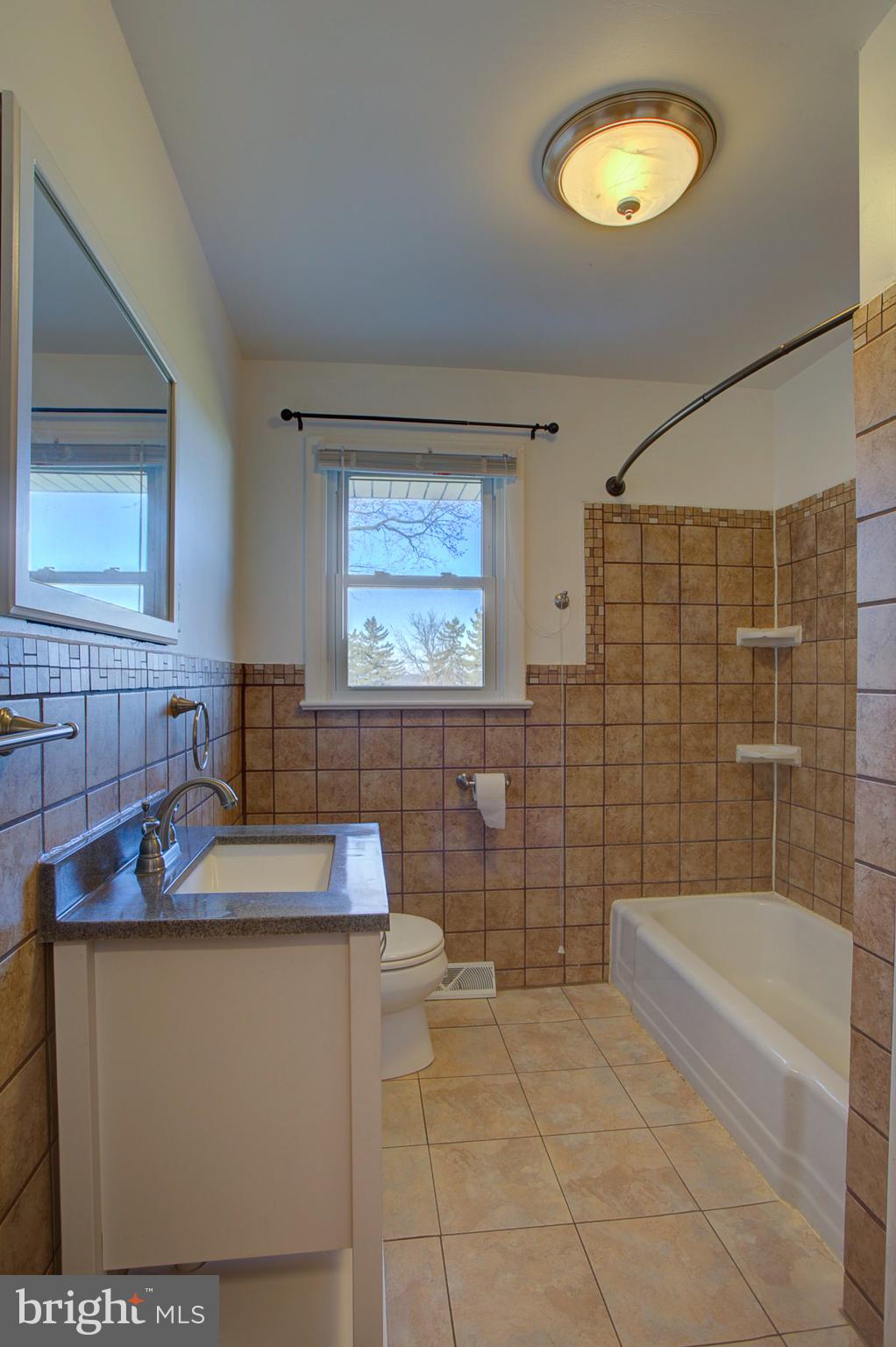 1047 Letort Road Conestoga, PA 17516 - Photo 14 of 30 a bathroom with a sink toilet and tub