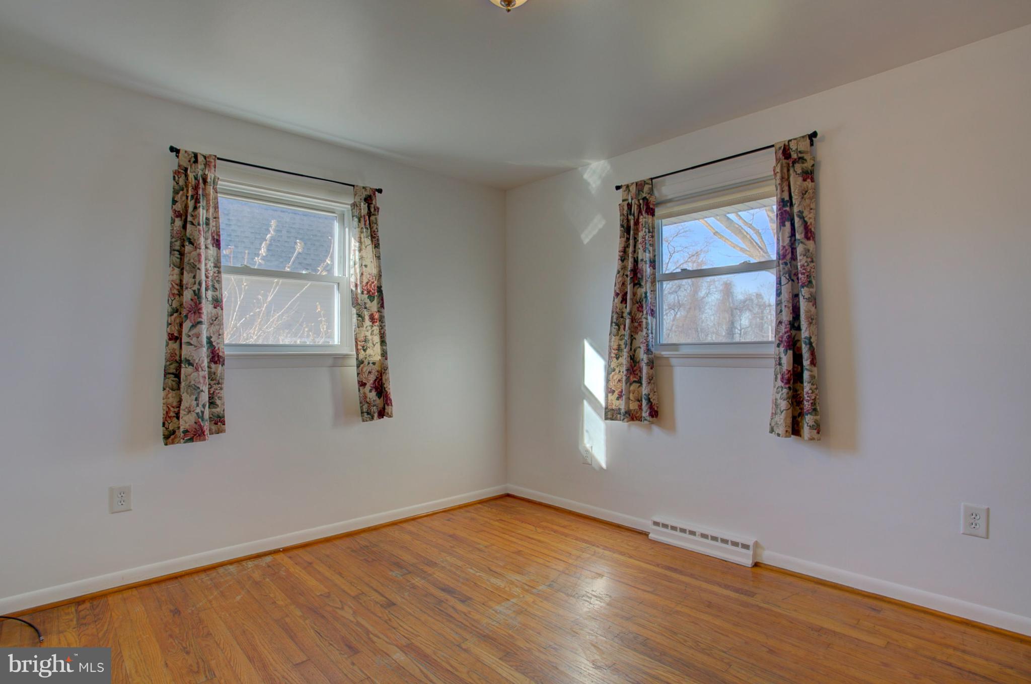 1047 Letort Road Conestoga, PA 17516 - Photo 15 of 30 an empty room with wooden floor and windows
