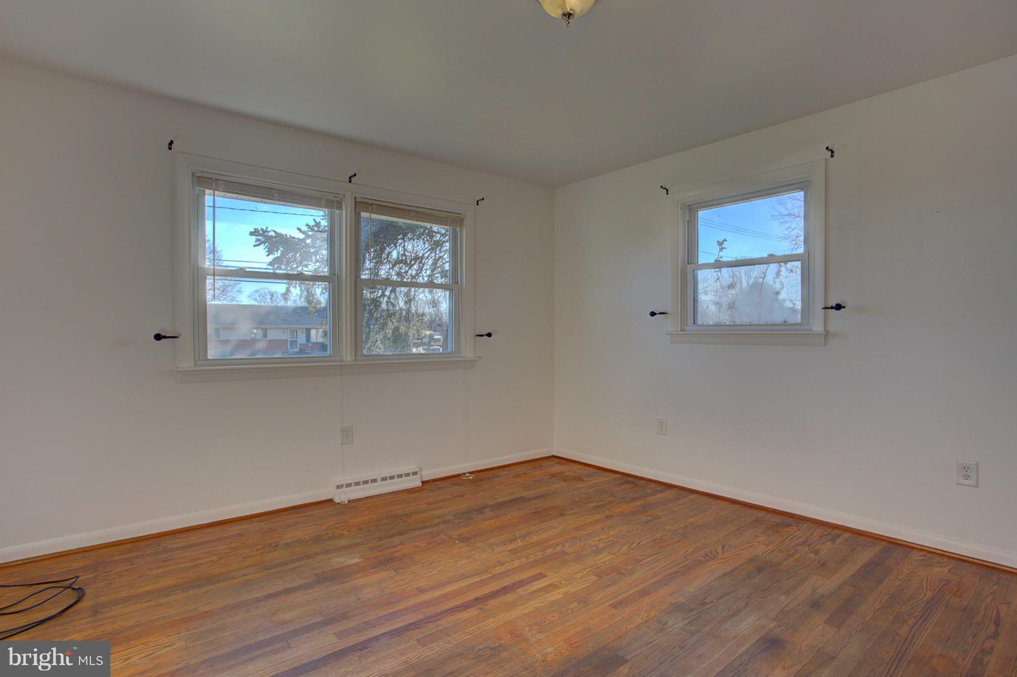 1047 Letort Road Conestoga, PA 17516 - Photo 17 of 30 a view of empty room with wooden floor and fan