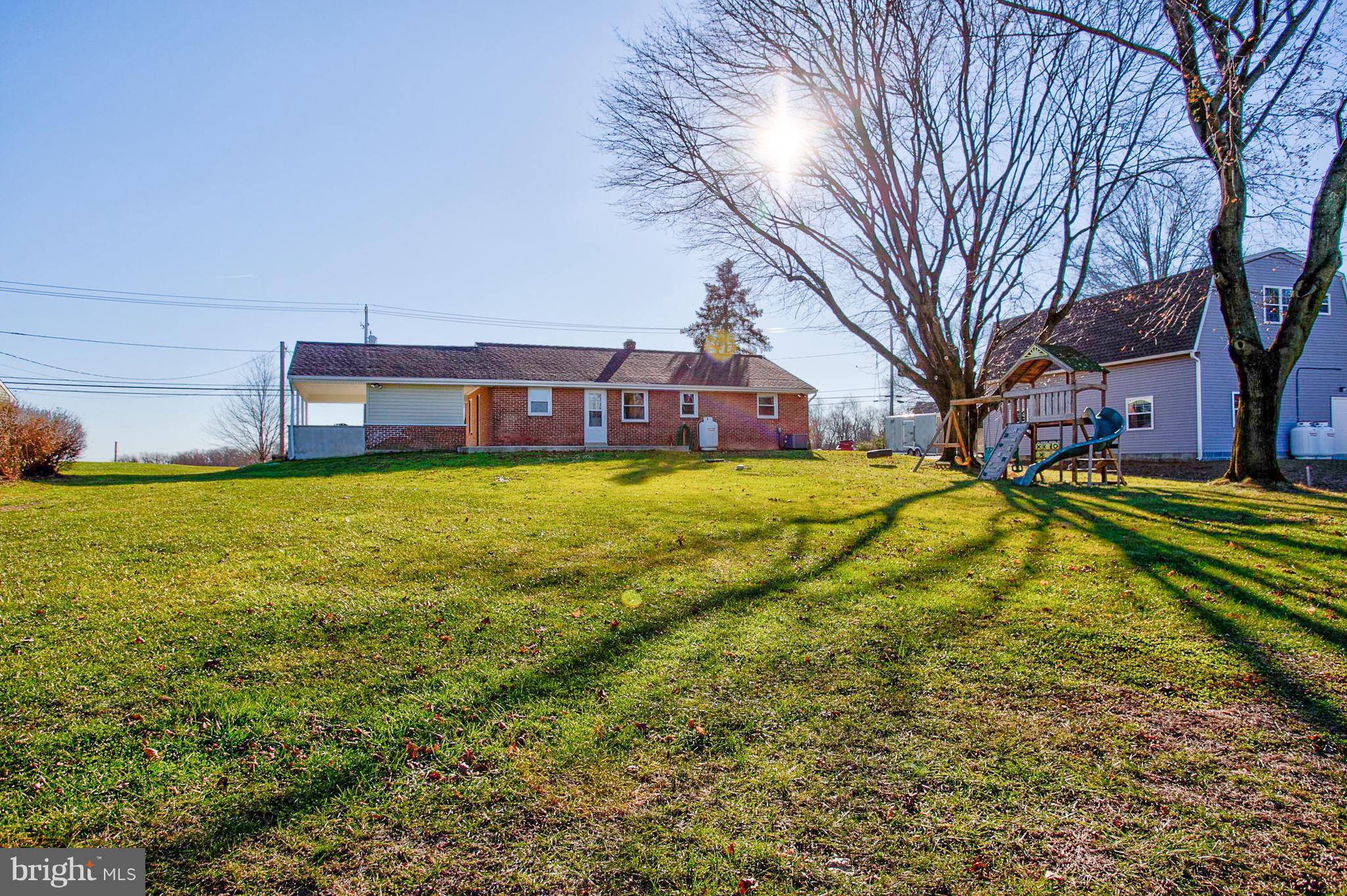 1047 Letort Road Conestoga, PA 17516 - Photo 24 of 30 a view of a house with a yard and sitting area