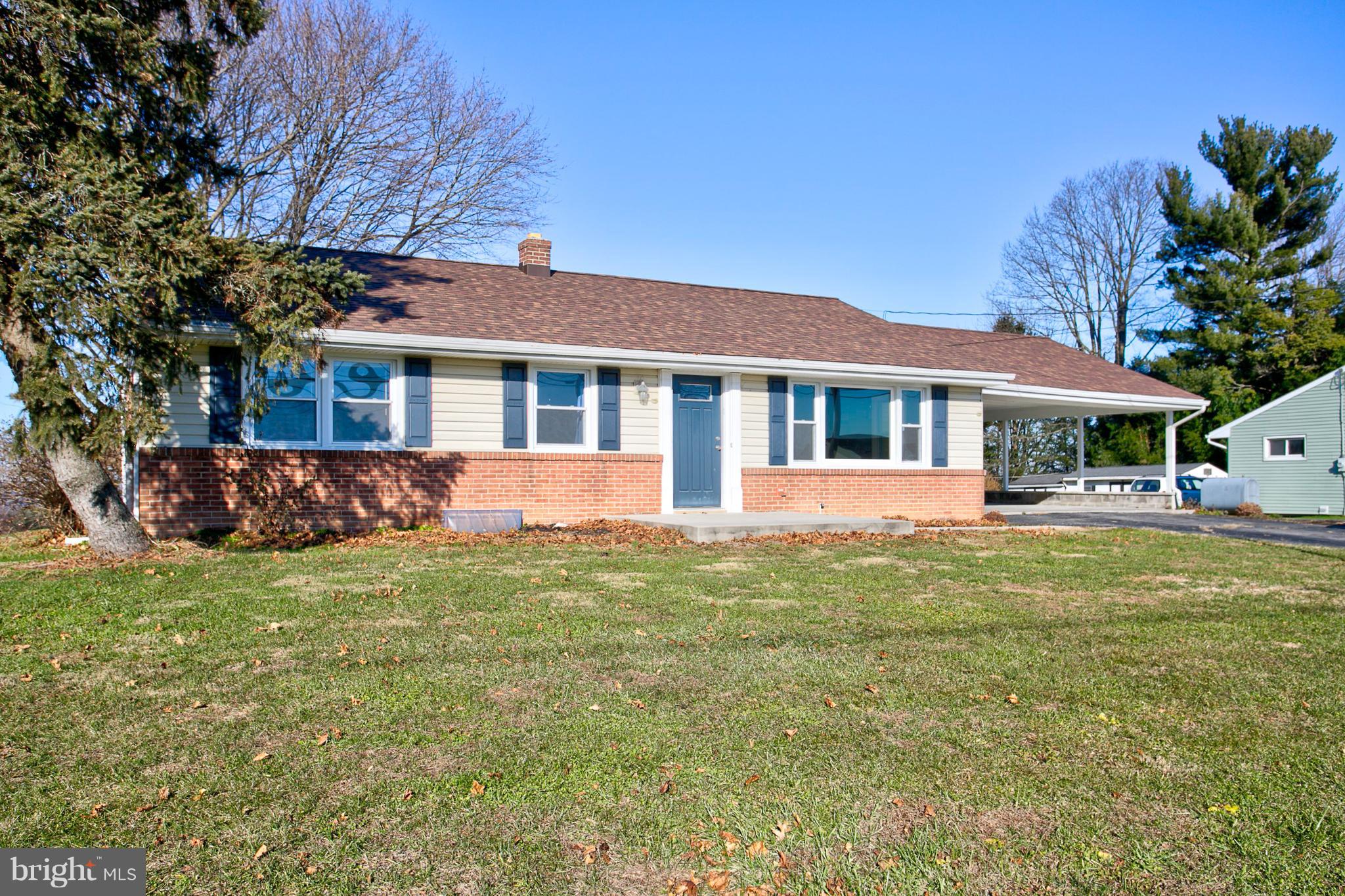 1047 Letort Road Conestoga, PA 17516 - Photo 4 of 30 a front view of a house with a garden