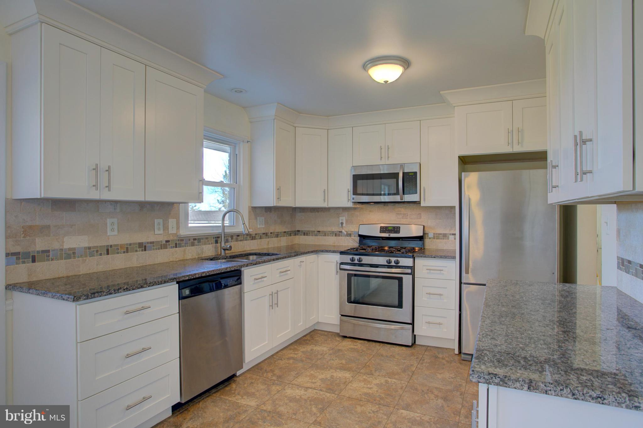 1047 Letort Road Conestoga, PA 17516 - Photo 6 of 30 a kitchen with cabinets stainless steel appliances and a counter space