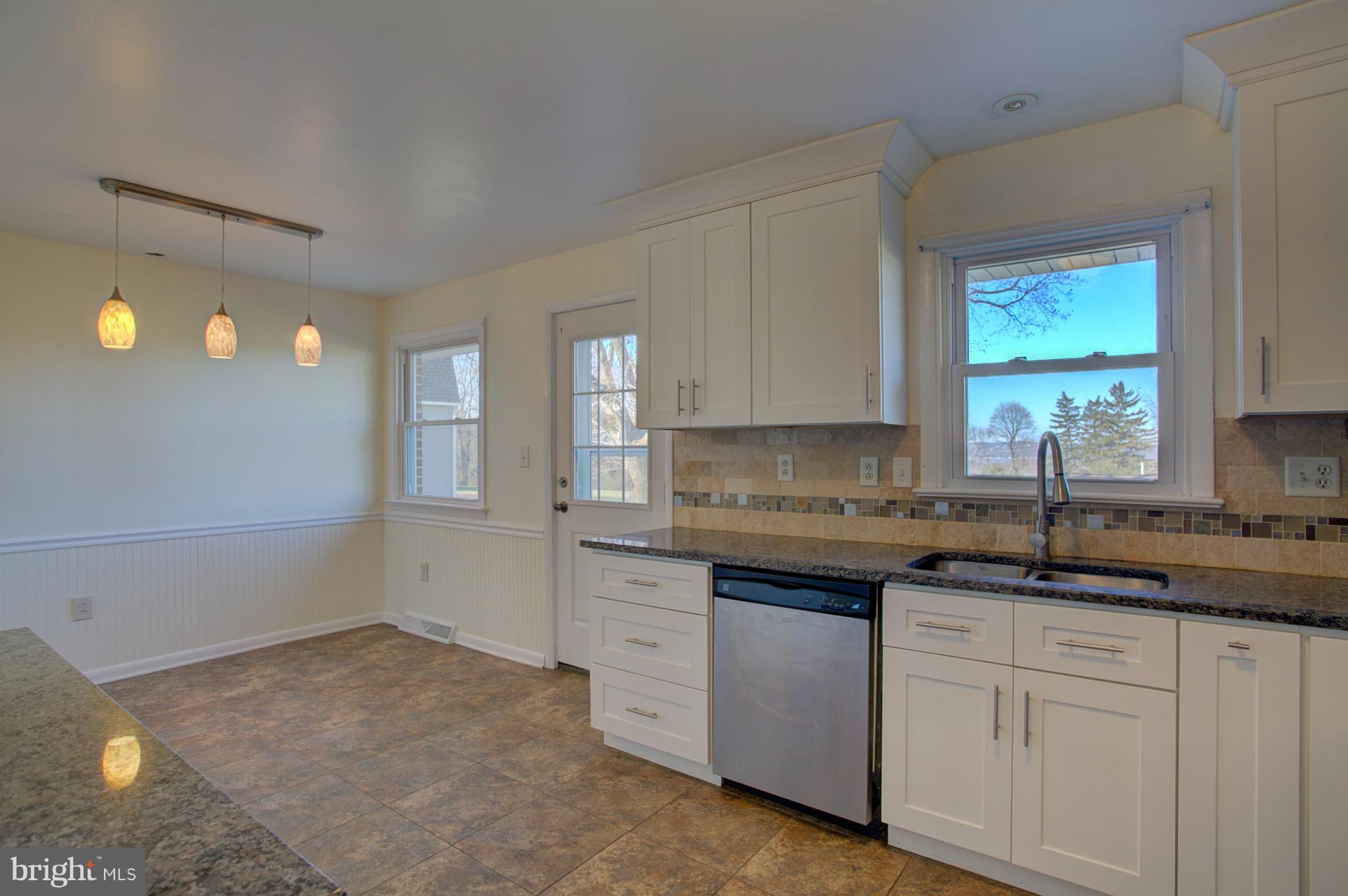 1047 Letort Road Conestoga, PA 17516 - Photo 7 of 30 a kitchen with white cabinets and sink