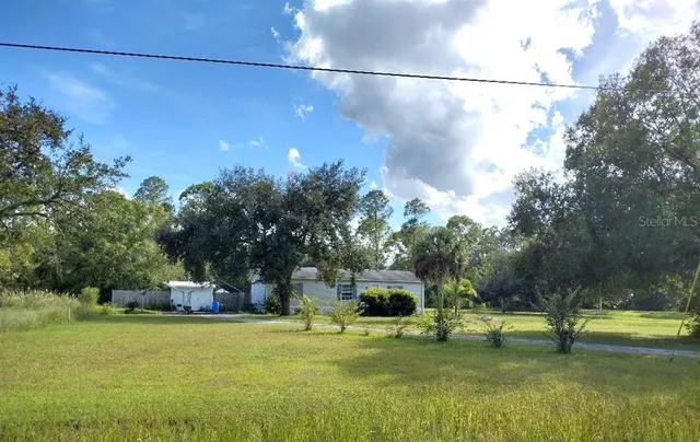 a fire hydrant in the middle of a field
