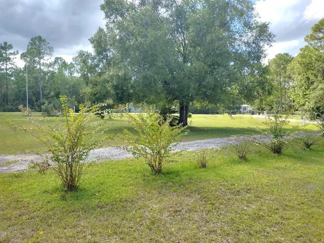 a view of a lake with a yard