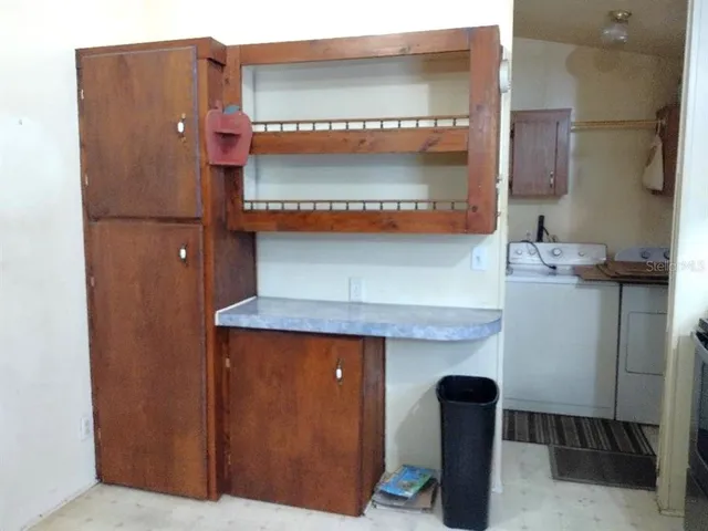 a room with cabinets and wooden floor
