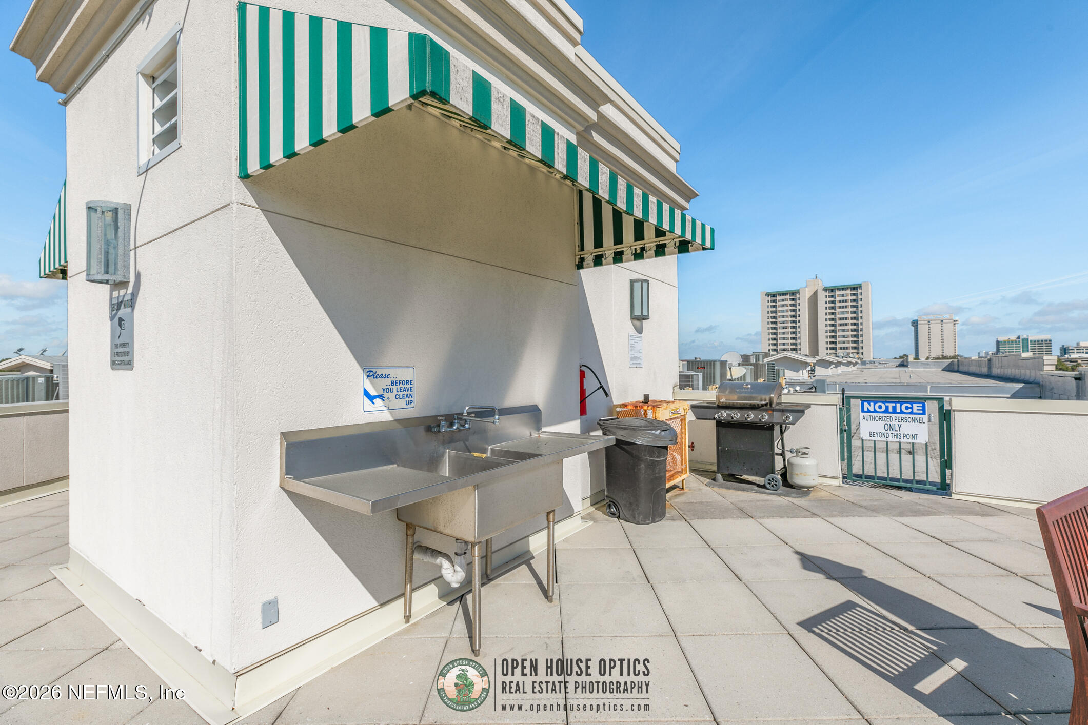 1661 Riverside Avenue, Unit 407 Jacksonville, FL 32204 - Photo 57 of 60 a view of roof deck with table and chairs