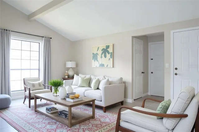 a living room with furniture and a large window