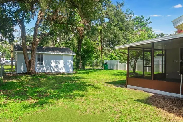 a view of a yard with a house and garden