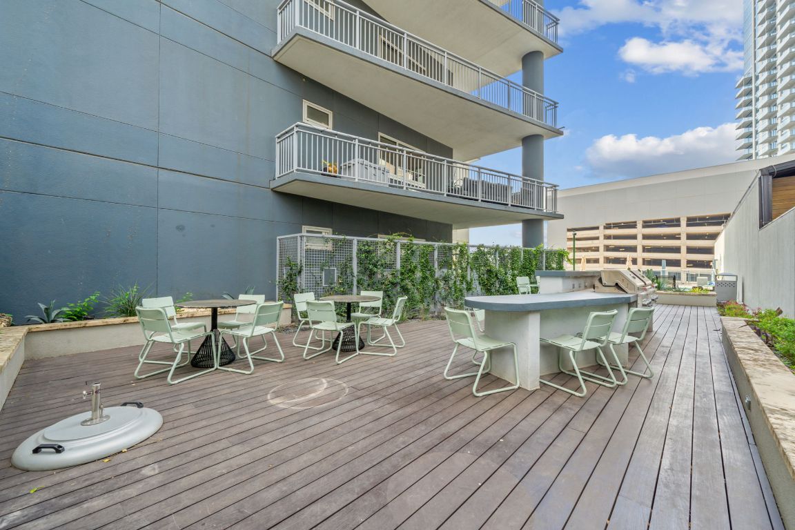603 Davis Street, Unit 710 Austin, TX 78701 - Photo 21 of 37 a view of a chairs and table in a patio